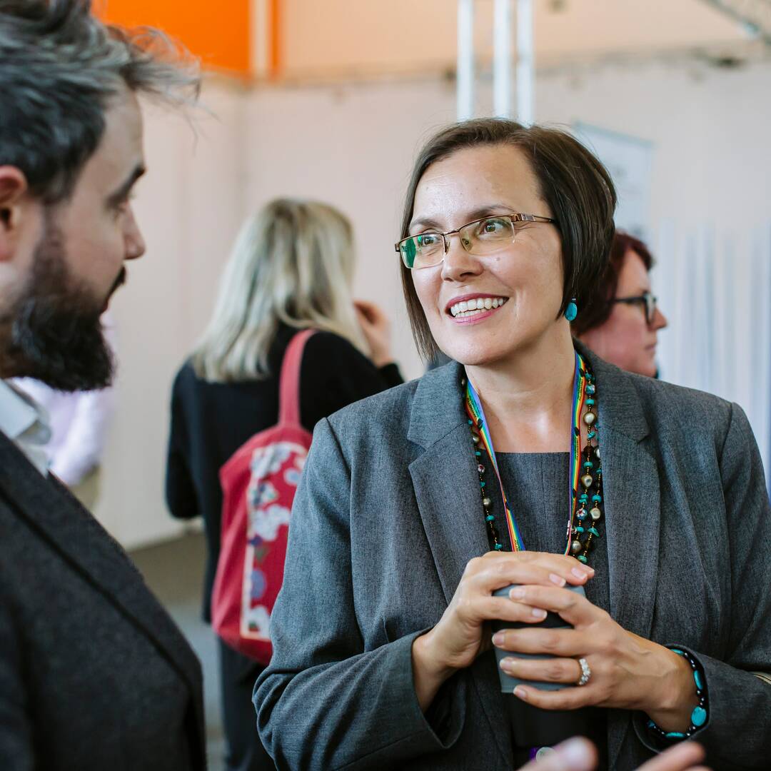 staff talking at an event