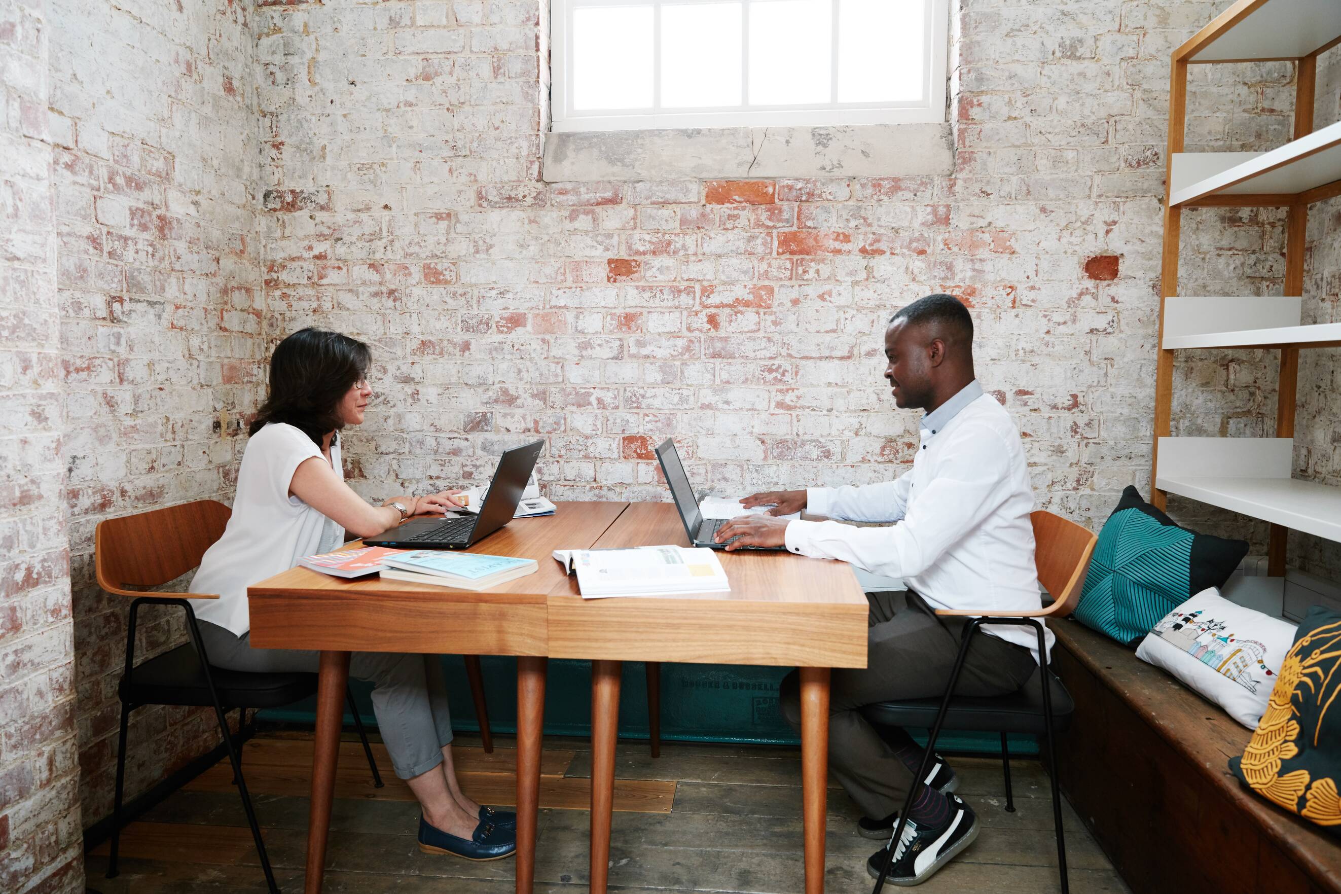 Cell Block Studios 2 people sitting within an office